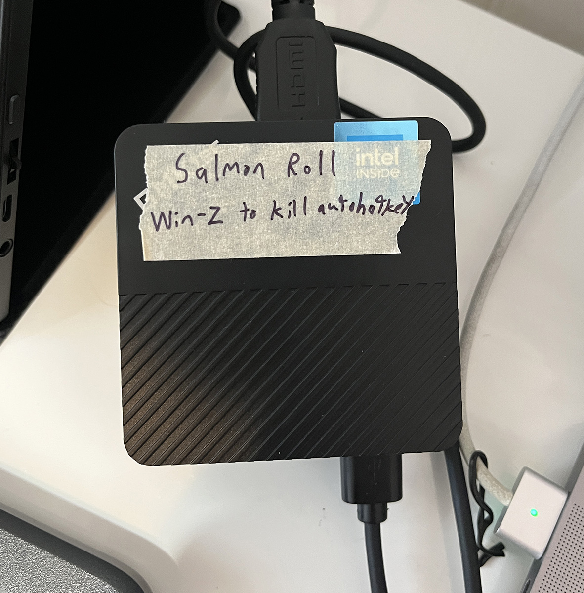Computer labeled with masking tape that says "Win-Z to kll autohotkey"